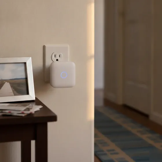 Wi-Fi extender plugged into hallway outlet in Denton home